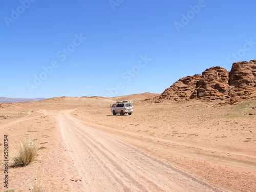 Foreign tourists in cars traveling on the roads of Mongolia.