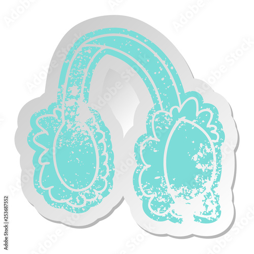 distressed old sticker of pink ear muff warmers