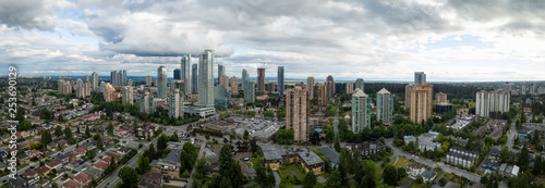 Aerial Panoramic view of residential homes in a modern city during a vibrant summer cloudy day. Taken in Burnaby, Vancouver, BC, Canada.