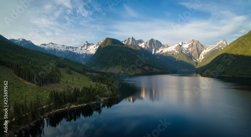 Aerial view of a scenic lake in the Canadian Mountain Landscape during a vibrant summer sunrise. Taken at Jones Lake near Chilliwack and Hope, East of Vancouver, BC, Canada. © edb3_16