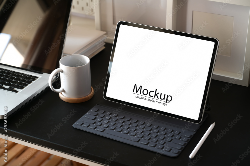 Workspace working desk with mock up tablet and laptop Workspace working desk with mock up tablet and laptop