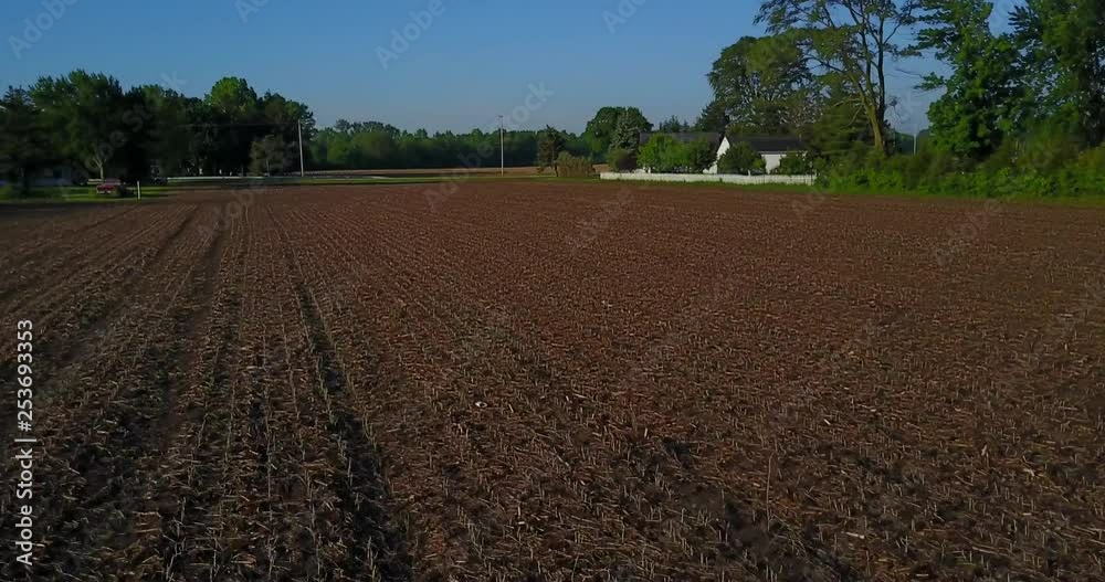 AERIAL, flight over a crop field ready to be worked AERIAL, flight over a crop field ready to be worked