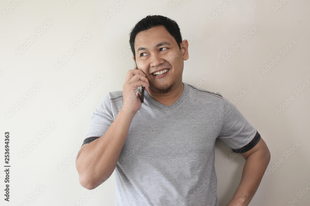 Young Man Talking on his Phone, Happy Smiling Laughing Young Man Talking on his Phone, Happy Smiling Laughing
