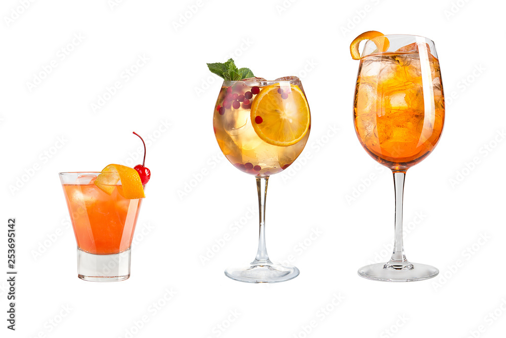A variety of alcoholic drinks, beverages and cocktails in pans on a white background. Three different drinks with fruit and berries decoration.