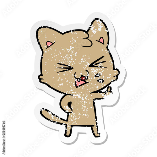 distressed sticker of a cartoon hissing cat