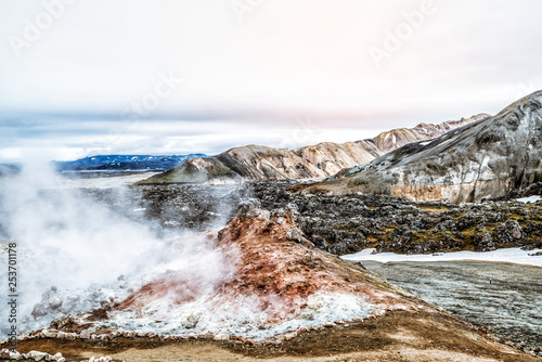 Landscape of Landmannalaugar surreal nature scenery in highland of Iceland, Nordic, Europe. Beautiful colorful snow mountain terrain famous for summer trekking adventure and outdoor walking. photo