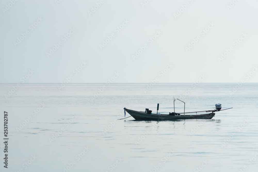 A lone boat floats in the sea. A lone boat floats in the sea.