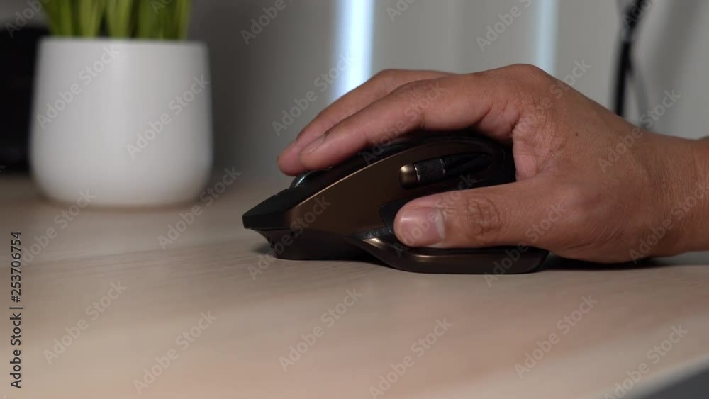 Hand on mouse clicking and scrolling Hand on mouse clicking and scrolling