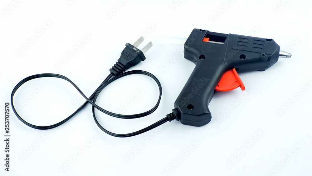 Electric hot glue gun isolated on white background Electric hot glue gun isolated on white background