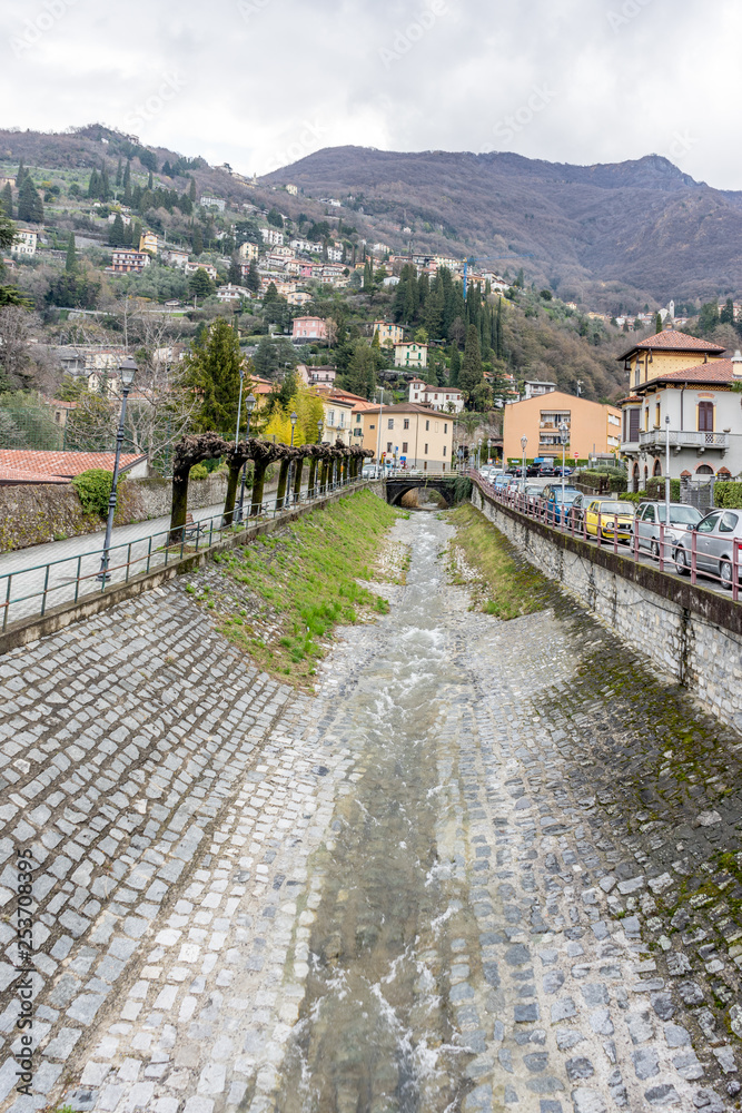 Italy, Varenna, Lake Como, a stream flowing into the mountain