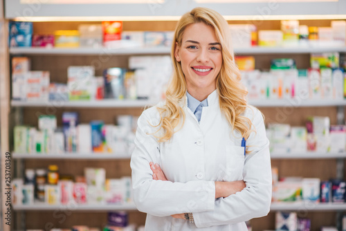 Medicine, pharmaceutics, healthcare and people concept. Portrait of a happy female pharmacist.