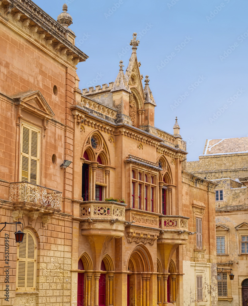 Typical yellowish tones of medieval architecture in the historic city of Mdina, Malta.