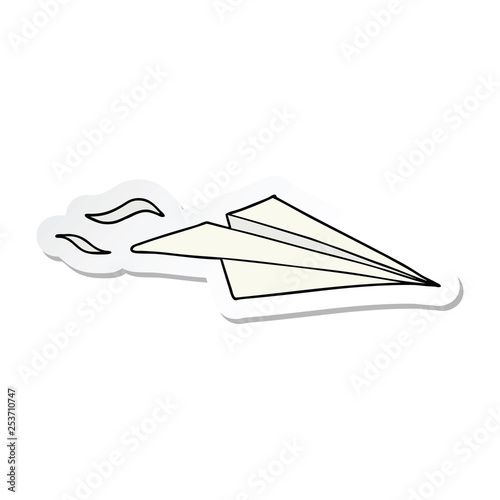 sticker of a cartoon paper airplane
