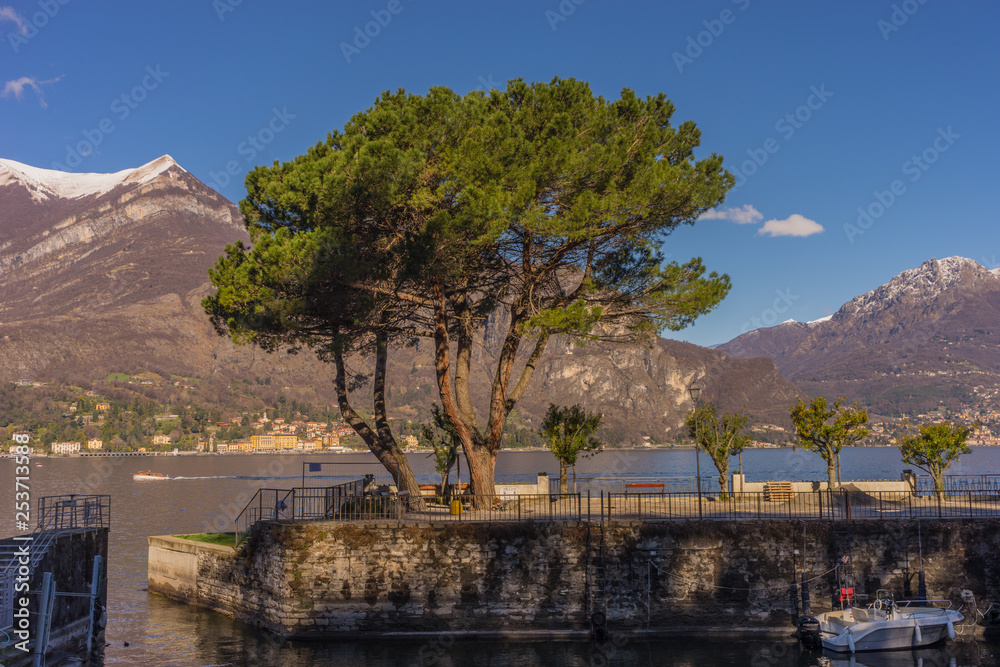 Italy, Bellagio, Lake Como, a lake with a mountain in the background