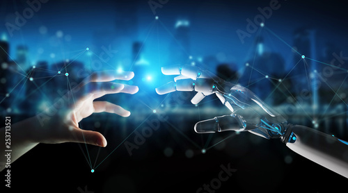 Robot hand making contact with human hand on dark background 3D rendering © sdecoret