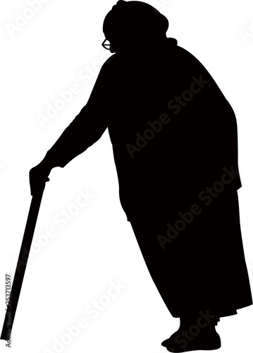 an old woman walking with baton