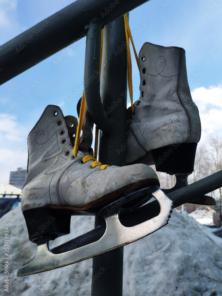 Old skates hanging on laces