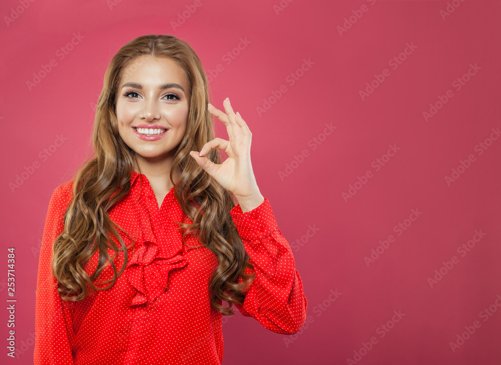 Young pretty happy woman with okay gesture on bright pink background. Student girl showing ok sign, portrait Young pretty happy woman with okay gesture on bright pink background. Student girl showing ok sign, portrait