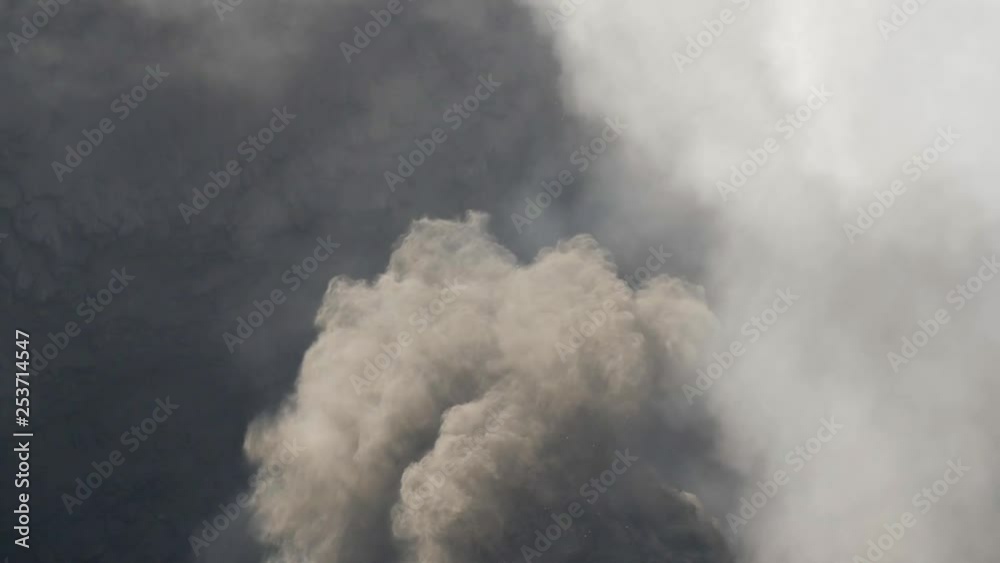 Ash clouds rising from Bromo active volcanic crater close up viewpoint. Ash clouds rising from Bromo active volcanic crater close up viewpoint.