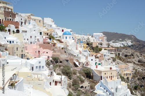 Santorini village view with typical church in the centre with a blue dome