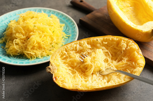 Cooked spaghetti squash and fork on table photo