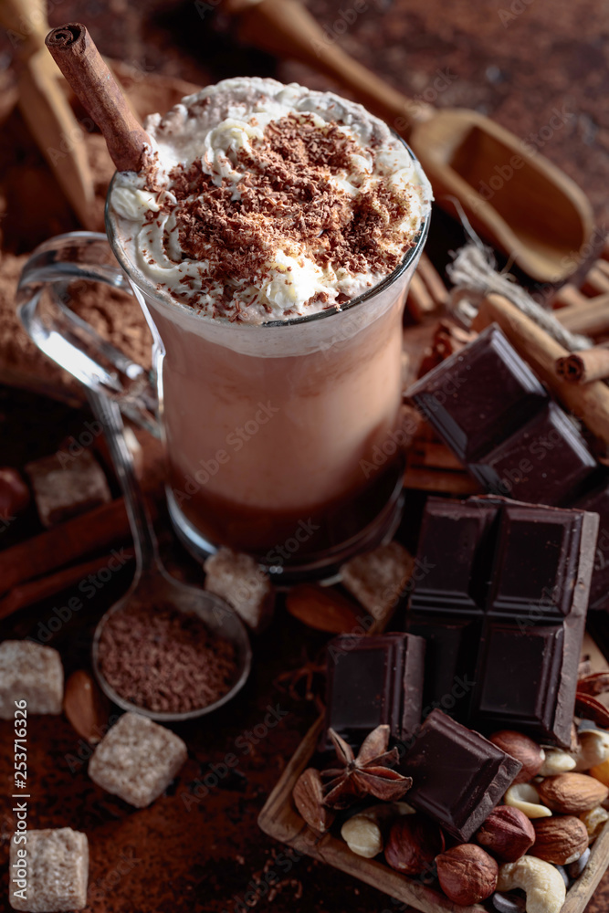 Cocoa with cream, cinnamon, chocolate pieces and various spices. Cocoa with cream, cinnamon, chocolate pieces and various spices.