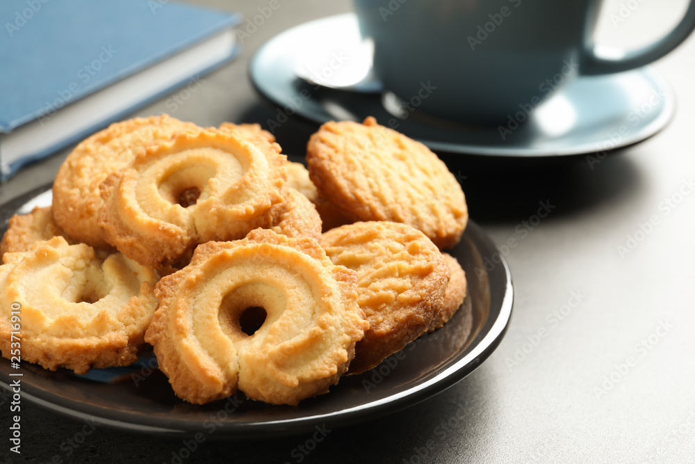 Plate with Danish butter cookies on table. Space for text