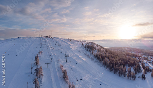 Aerial view of one of the ski slopes in Idre Fjall, Sweden during an early morning sunrise a cold winter day. 