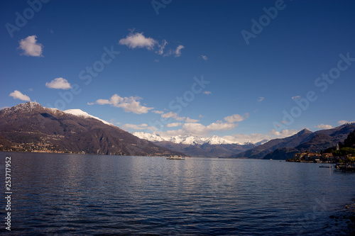 Italy  Bellagio  Lake Como  a large body of water with a mountain in the background