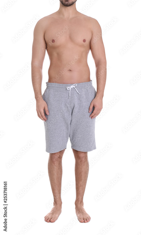 Young man on white background, closeup. Weight loss Young man on white background, closeup. Weight loss