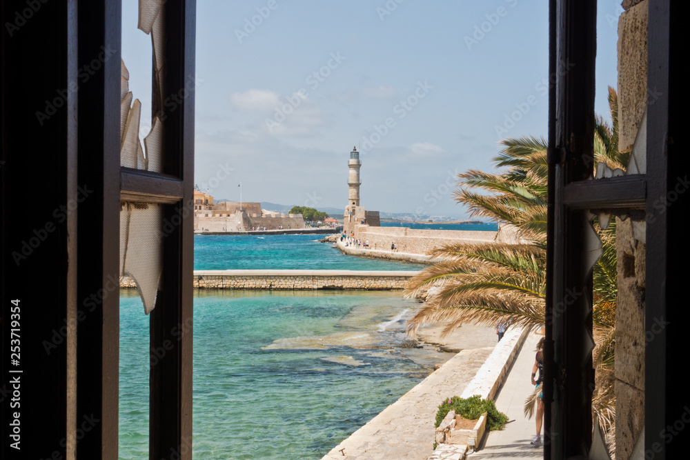 A view of a lighthouse at the old Venetian harbor, city of Chania, Crete island, Greece