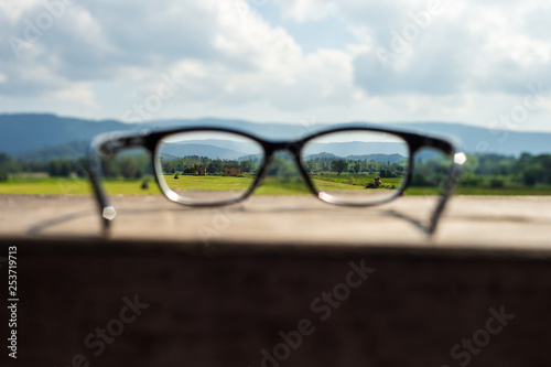 glasses on a background of blue sky