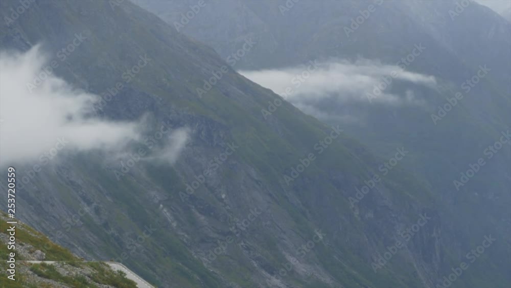 Close view of the mountains of Trollstigen with clouds. Close view of the mountains of Trollstigen with clouds.