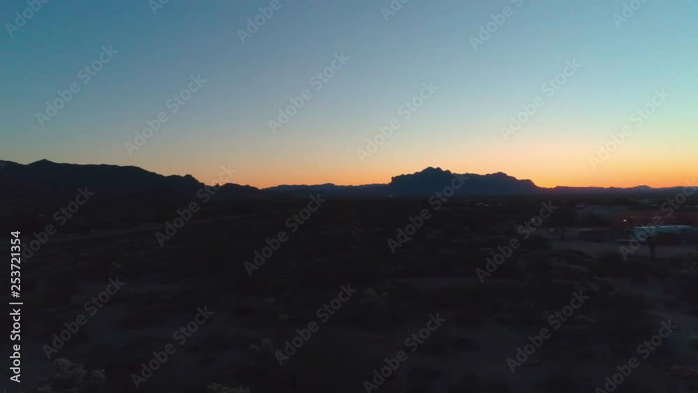 Aerial View of Mountain and Desert at Dawn with Town