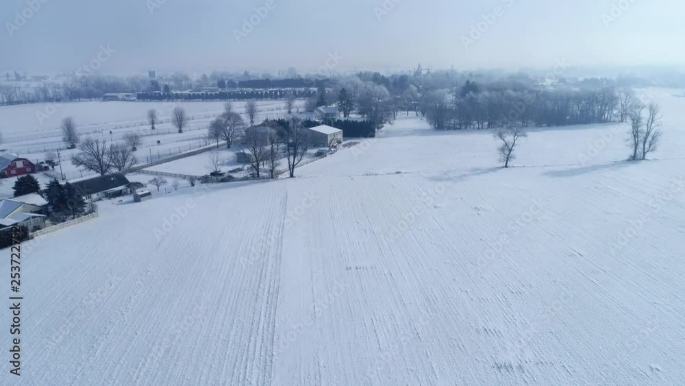 Aerial View of Early Morning Sunrise After a Snow Fall in Amish Countryside as Senn by s Drone Aerial View of Early Morning Sunrise After a Snow Fall in Amish Countryside as Senn by s Drone