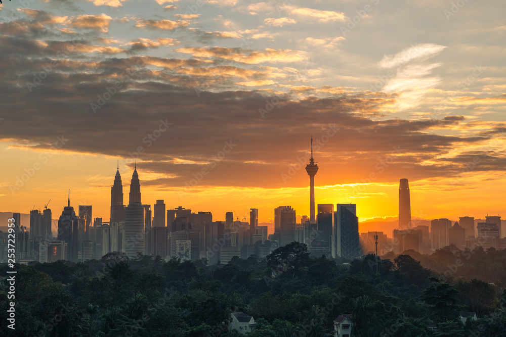 Majestic view of Kuala Lumpur cityscape during sunrise.