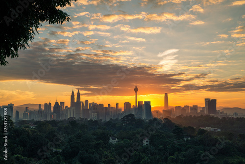 Photography Majestic view of Kuala Lumpur cityscape during sunrise.