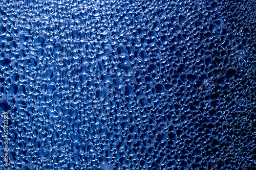 Many drops of water on the metal