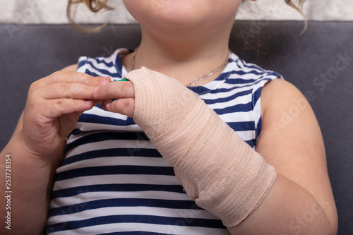 Little Girl With Bandage On Her Hand