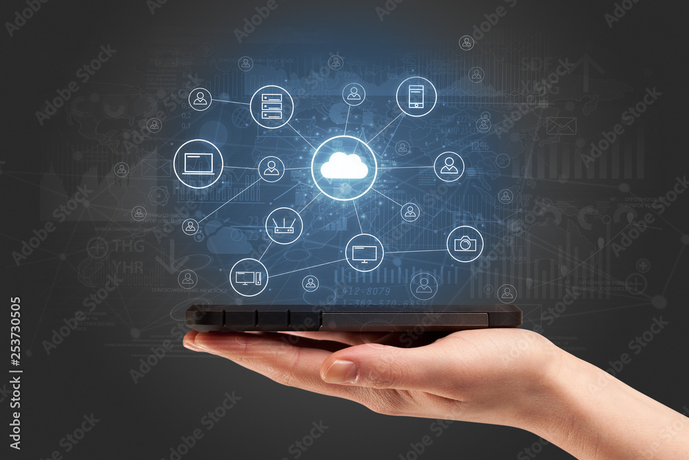 Businessman working on phone with reports and graphs concept around
Businessman working on phone with reports and graphs concept around