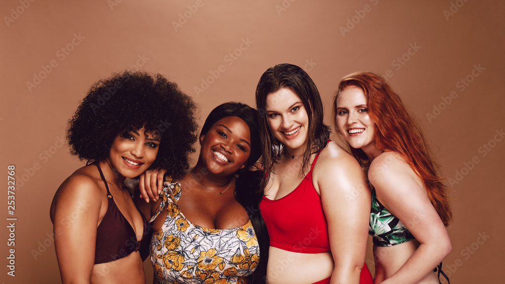 Group of happy different size women in bikinis Group of happy different size women in bikinis