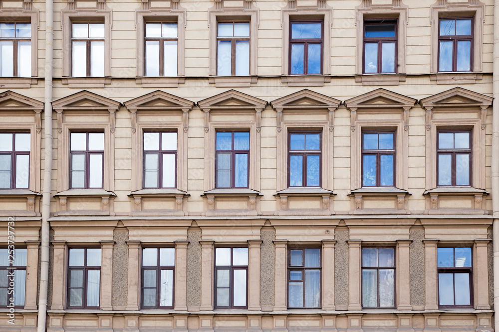 windows and details on an exterior of the building. windows and details on an exterior of the building.