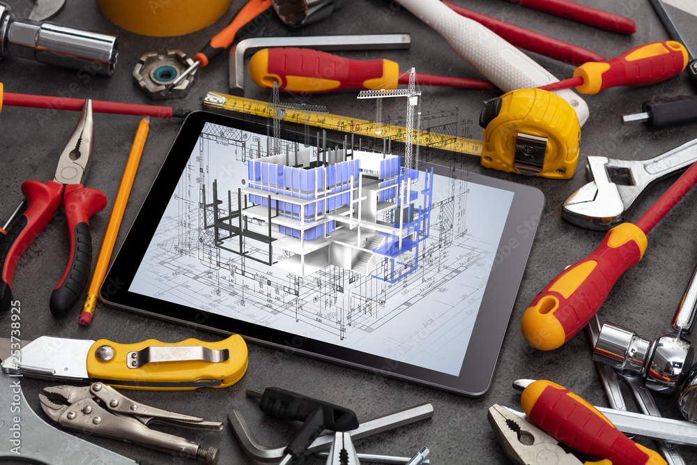 Tablet with construction tools and 3d house plan concept
Tablet with construction tools and 3d house plan concept