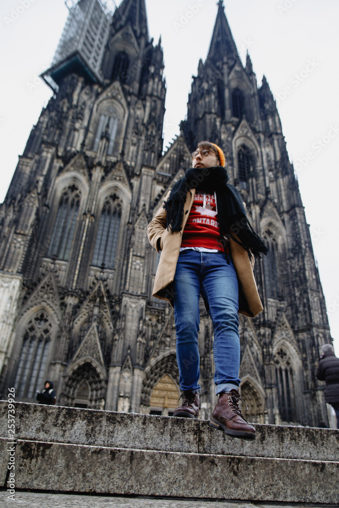 Fototapeta premium A man walks up the stairs. Cathedral. Germany. Gothic architecture. Cathedral Church of Saint Peter.
