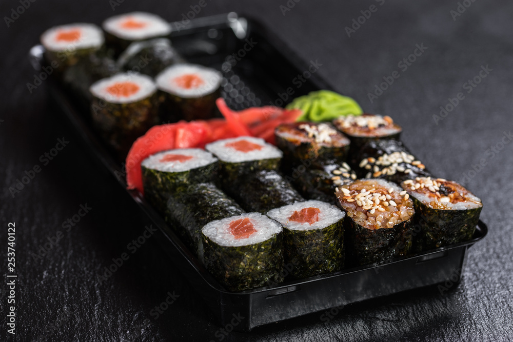 Maki in a takeaway container Maki in a takeaway container