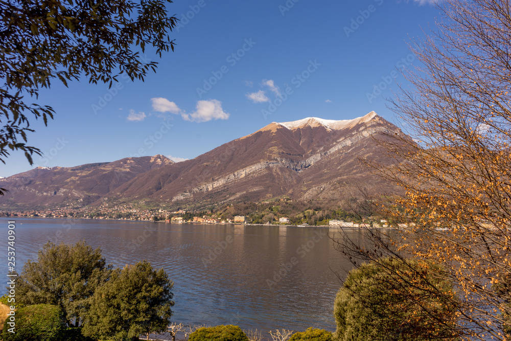 Italy, Bellagio, Lake Como, a body of water with a mountain in the background