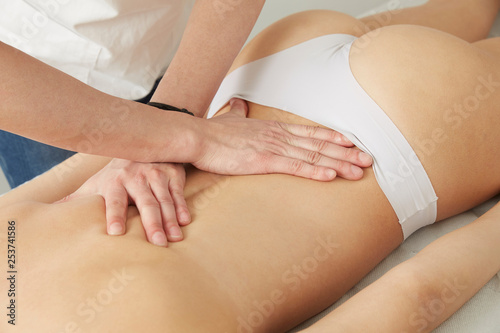 Female Enjoying Relaxing  Massage In Cosmetology Spa Center