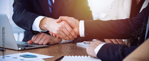Business people shaking hands at meeting or negotiation in the office. Handshake concept. Partners are satisfied because signing contract photo