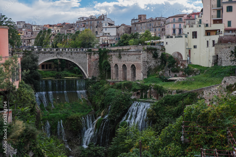 View of Tivoli from Gregorian villa with waterfalls and arch bridge