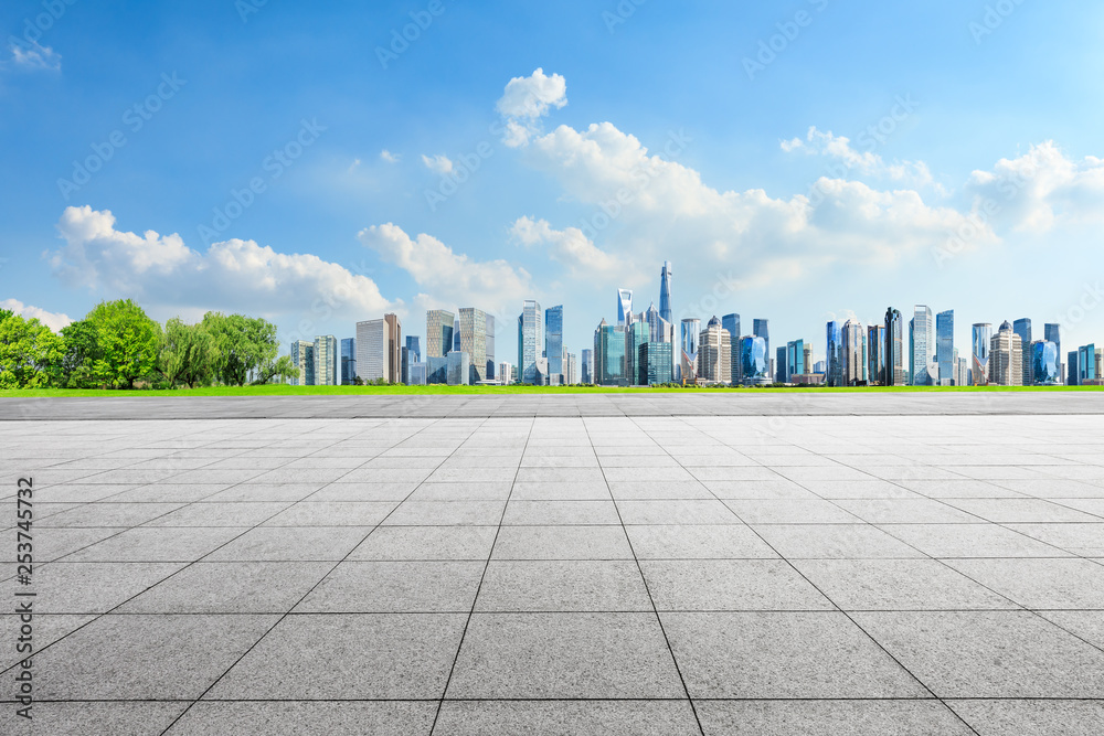 Empty square floor and panoramic city skyline with buildings in Shanghai